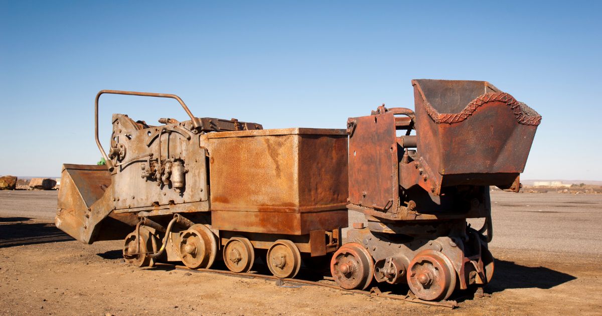 a rusty train on a track