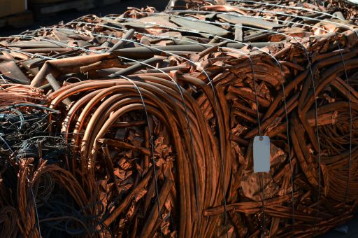 a large bundle of copper pipes